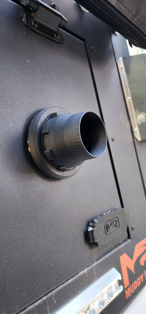 Close-up view of a diesel / Propex heater port installed on an aluminum camper topper showing the exterior mounting detail.