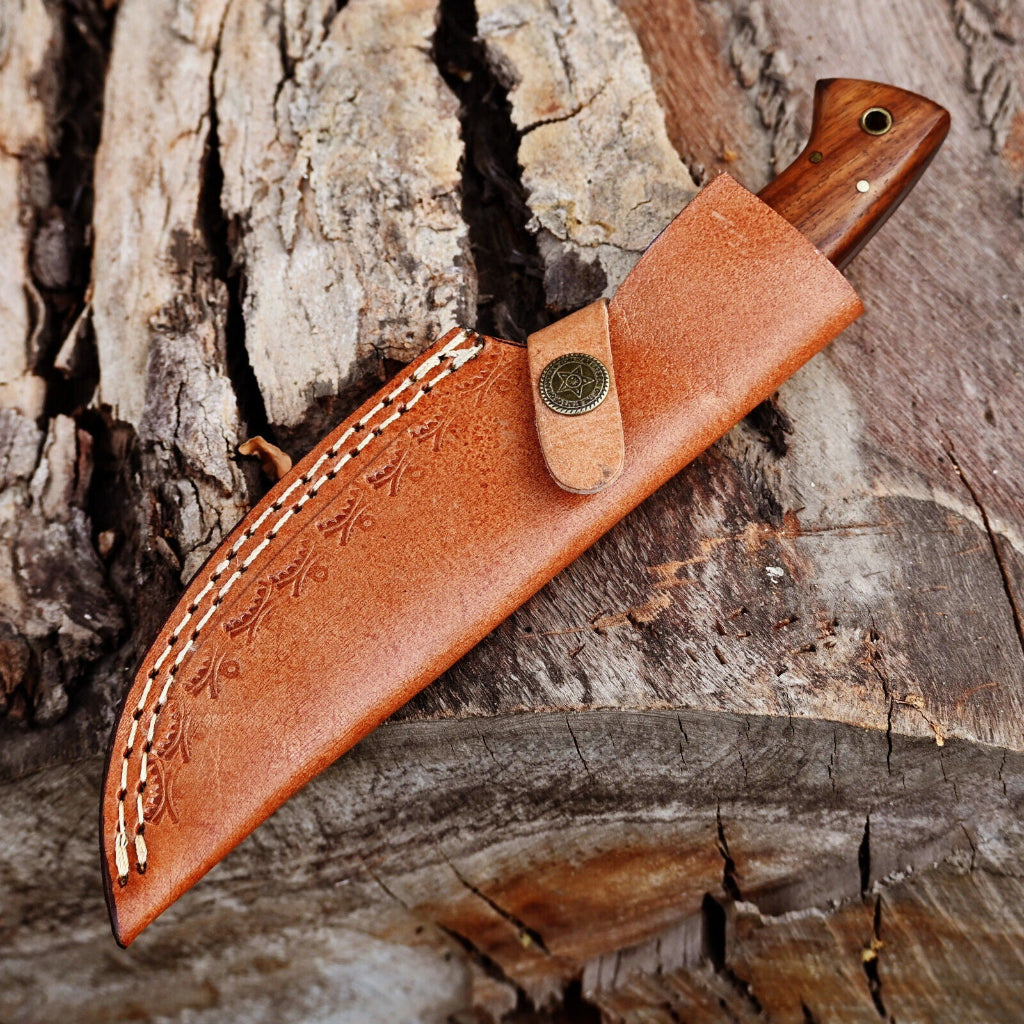 Brown leather knife sheath with wooden handle on a wooden surface