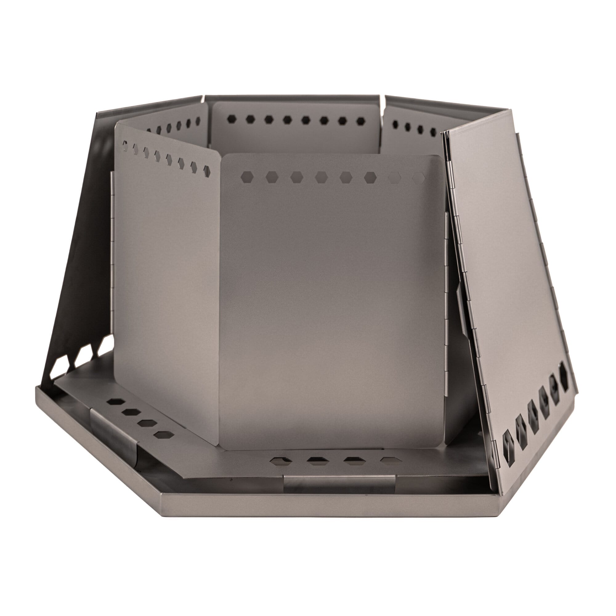 Hexagonal metal fire pit on a white background