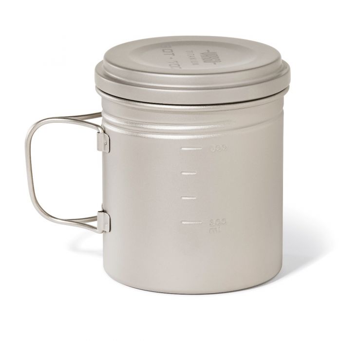 Metal camping mug with handle and lid on a white background