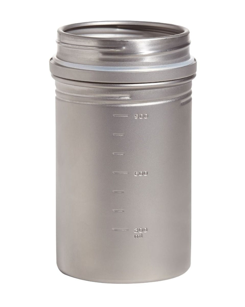 Stainless steel flask with measurement markings on a white background