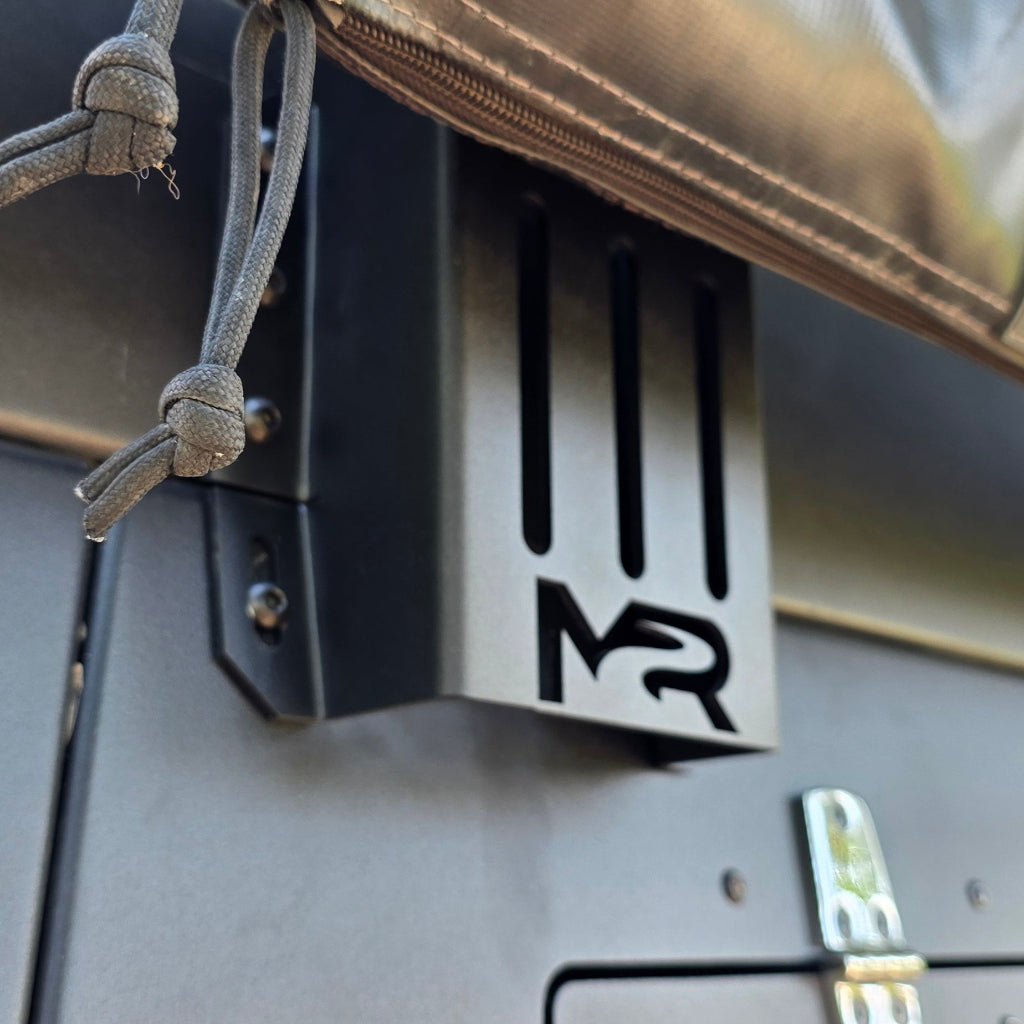 Close-up of a vehicle with the muddy river outdoors logo on the side