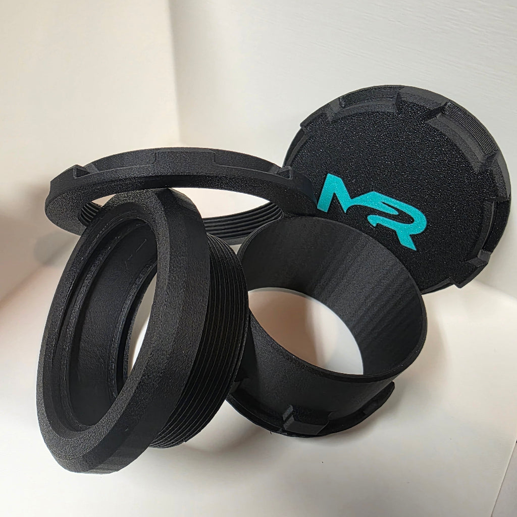 Diesel / Propex heater port components including threaded collar and cap designed for overland camper heating systems.