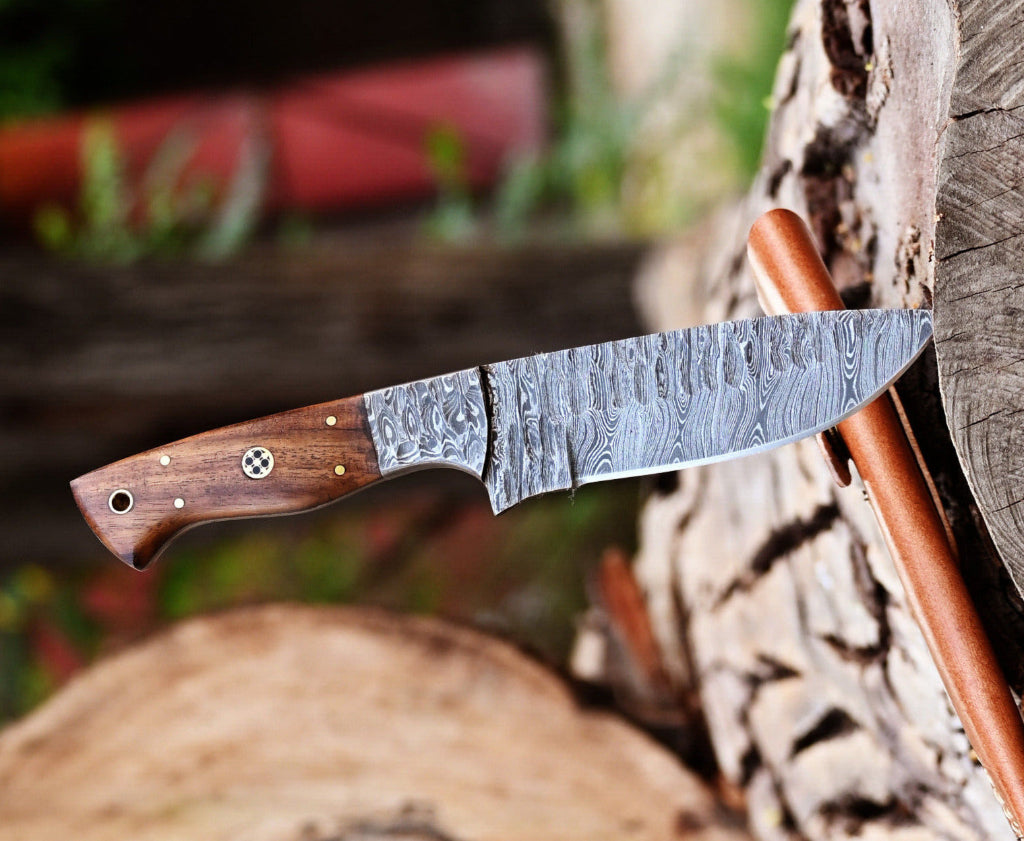Handcrafted knife with a wooden handle on a natural background