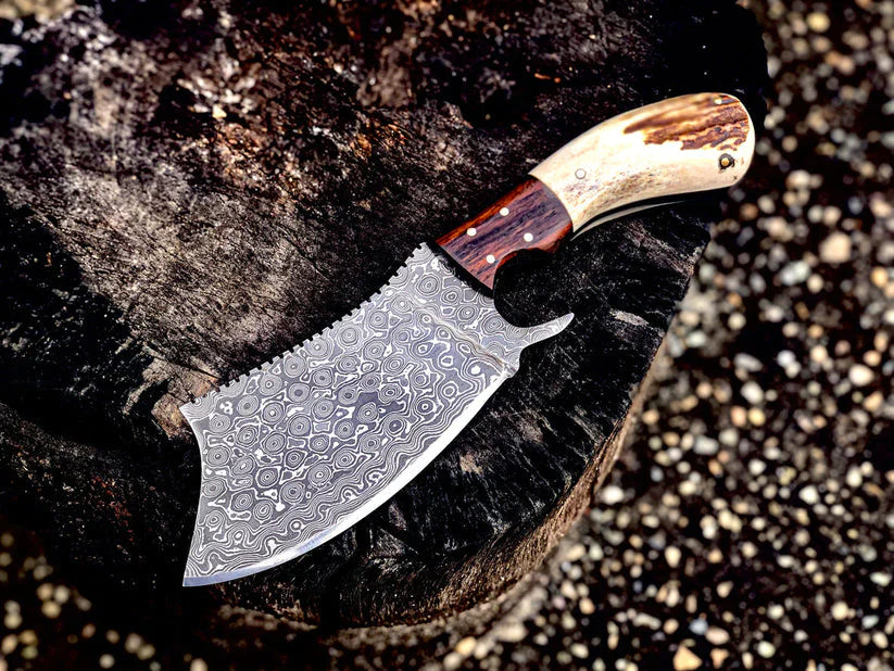 Decorative knife with a wooden handle on a dark stone surface